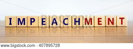 Impeachment Symbol. Wooden Cubes With The Word 'impeachment'. Beautiful Wooden Table, White Backgrou