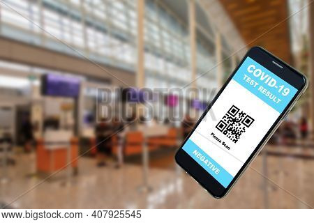 Mobile Phone App Showing Negative Covid-19 Test Result With Qr Code Against The Background Of An Air