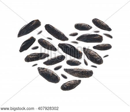 Roasted Rye Malt Grains In The Shape Of A Heart On A White Background