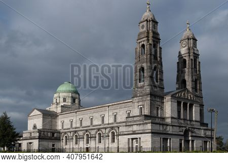 Cathedral Christ The King Against Dark Grey Sky.