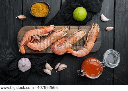 Mango Chutney Large Raw Shell On Raw King Prawns Ingredients Set, On Wooden Cutting Board, On Black 
