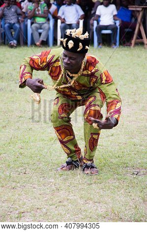 Bongouanou, Ivory Coast-august 20, 2015:  A Traditional Dancer With A Log Gold Chain At Once, Shetch