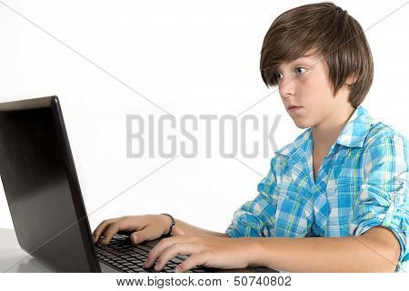 School Boy Working On A Laptop, Isolated On White