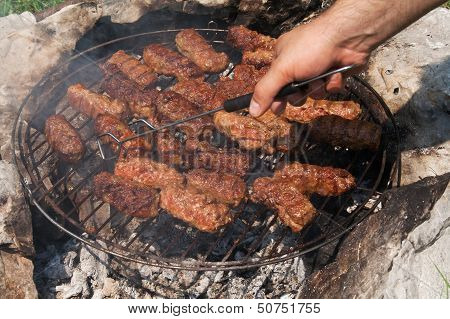 Barbecue On Open Space Fire
