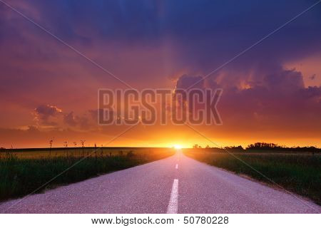 Empty Road At Sunset.