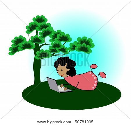 Girl with laptop under a tree