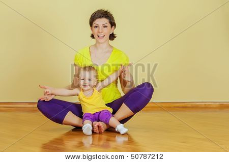 Mother Do Phisical Exercises With Her Daughter At Home