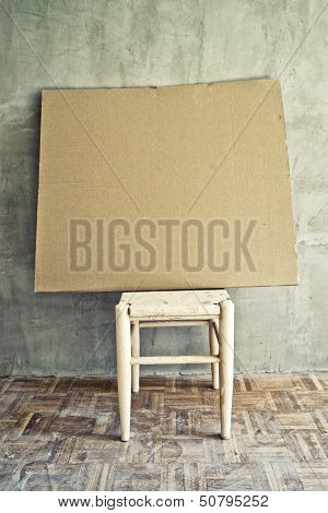 Old Vintage Chair And Empty Cardboard
