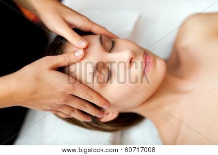 Beautiful woman having a facial massage 