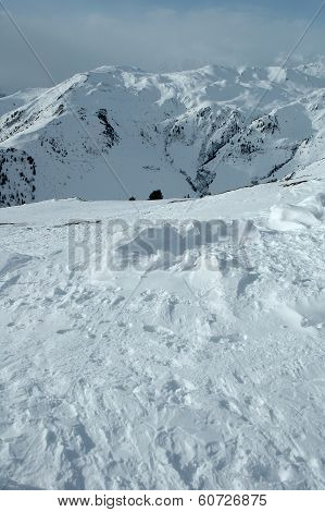 Snow And Peaks In Alps In Winter