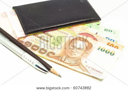 Workplace notebook with money and a pen isolated