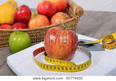 Apple Placed On A Scales,