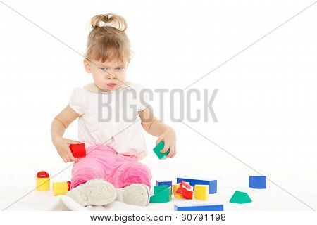 Resentful Girl With Educational Toys.