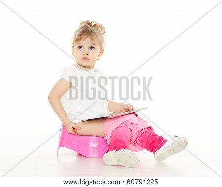 Pretty Little Girl Sits On Potty.