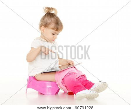 Pretty Little Girl Sits On Potty.