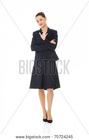 Anoyed and displeased businesswoman standing