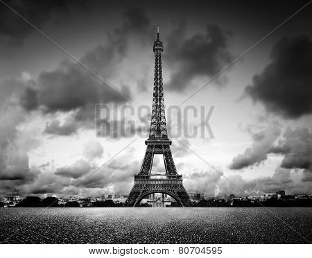 Artistic image of Effel Tower, Paris, France. Black and white, vintage mood with dramatic sky.