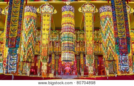 BYLAKUPPE, INDIA - FEBRUARY 10: Brightly decorated Buddhist temple in Namdroling Monastery in Bylakuppe, Karnataka, India on February 10, 2013