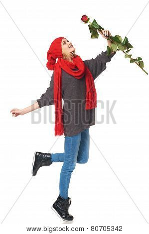 Beautiful woman holding red rose