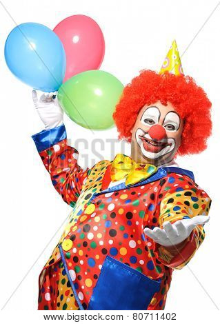 Portrait of a smiling clown with balloons isolated on white