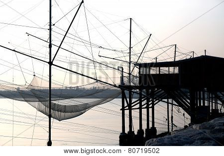 Fishing Nets Over The Stilt Houses Of Wood