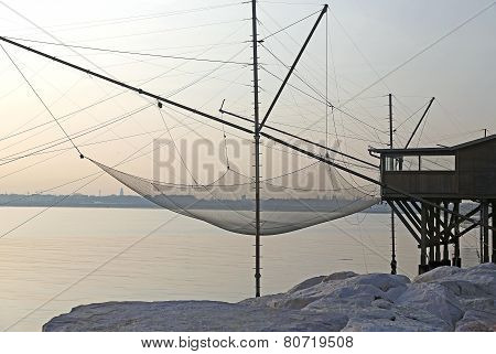 Fishing Nets Over The Stilt Houses Of Wood