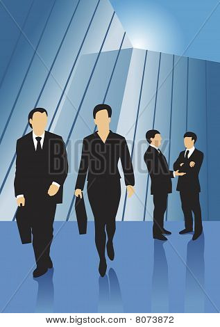 Affärsmän framför glasbyggnad