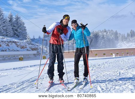A man and a girl relaxing after training at Cheile Gradistei Biathlon Arena - Cross country skiing