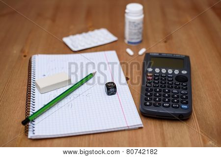 Study Place With Calculator And Painkillers In Background