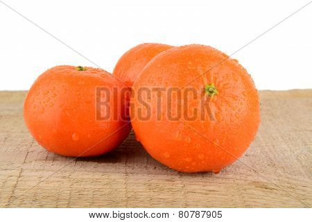 Studio Shot Mandarines,tangerines Isolated On Wooden Table