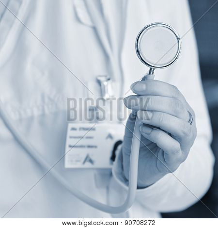 Close-up of female doctor using stethoscope , focus on stethoscope