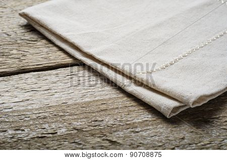natural beige cotton cloth on wooden table