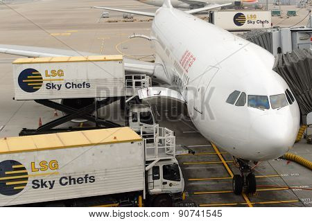 HONG KONG - MARCH 09, 2015: aircraft docked in Hong Kong International Airport. It is the main airport in Hong Kong. It is located on the island of Chek Lap Kok