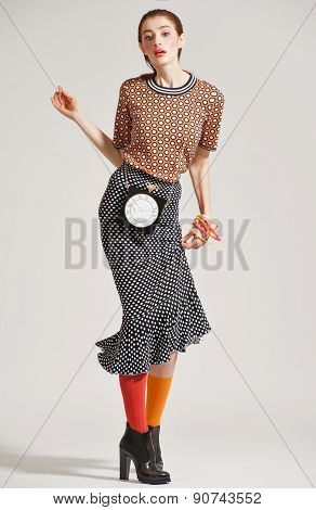 Fashion model pose on light background