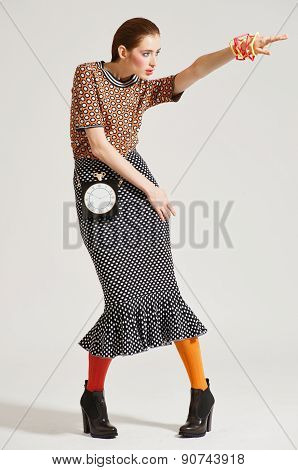 Fashion model pose on light background