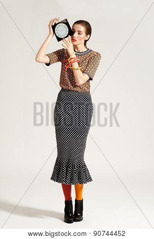 Fashion model pose on light background