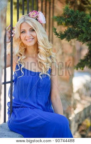 Summer portrait of a beautiful woman in a Park.