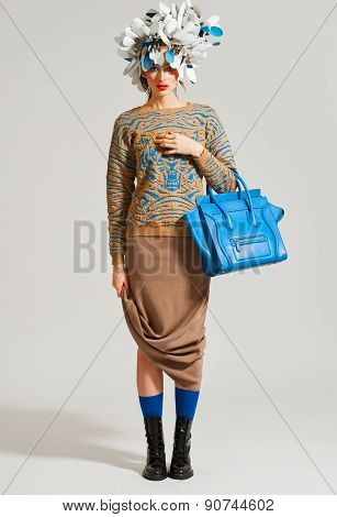 Fashion model pose on light background