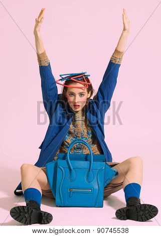 Fashion model pose on light background