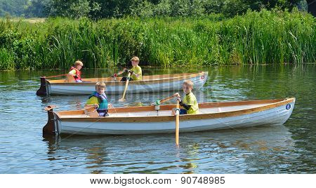 Children in rowing boats