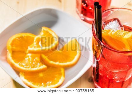 Close-up Of Glass Of Spritz Aperitif Aperol Cocktail With Orange Slices And Ice Cubes