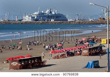 Beautiful landscape of Manta beach with a luxury cruise in the background, Ecuador