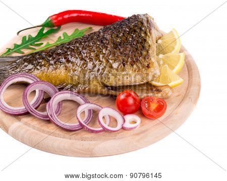 Fried carp tail with lemon and pepper.