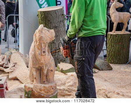 Wood carving artist at work