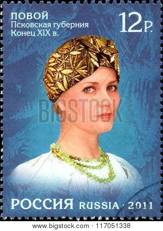 RUSSIA - CIRCA  2011: stamp printed in Russia, shows a woman in a female headdress of  Russian North