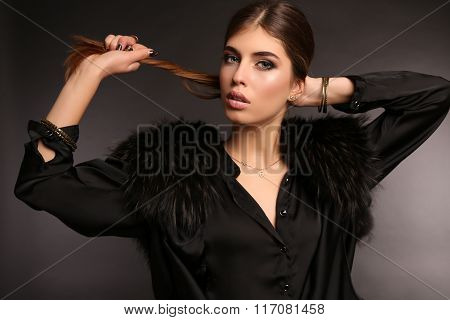 Beautiful Woman With Dark Straight Hair Wears Elegant Clothes And Bijou