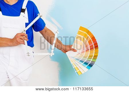 Color Palette And A Yardstick Shaped As An House