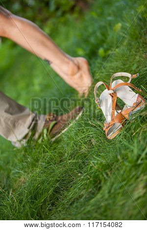 feet guys and girls on the grass