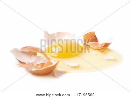 Cracked raw chicken egg isolated