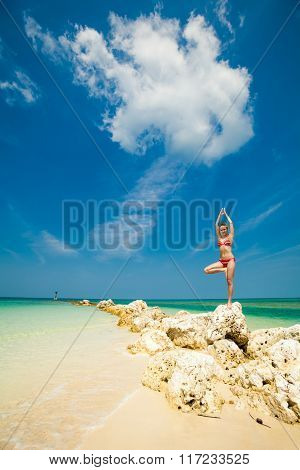 Summer yoga session on a beach